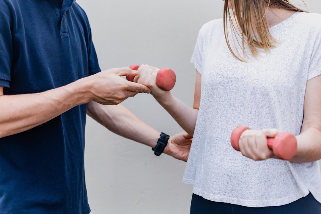 a-man-and-a-woman-holding-dumbs-in-their-hands-inozpsbqrqk